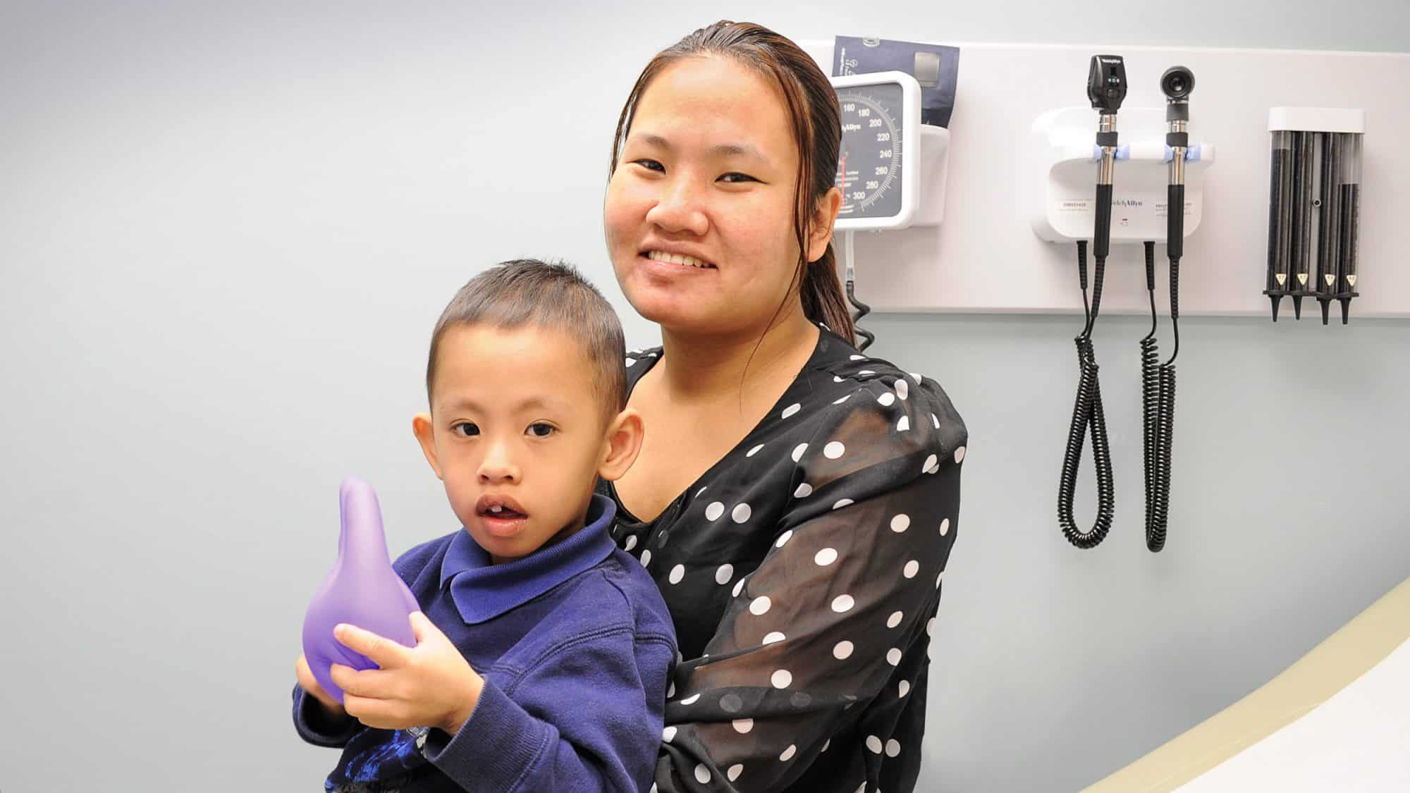 Baltimore Medical System asthma and allergy patient, two year old Cruz Ma and his mother.